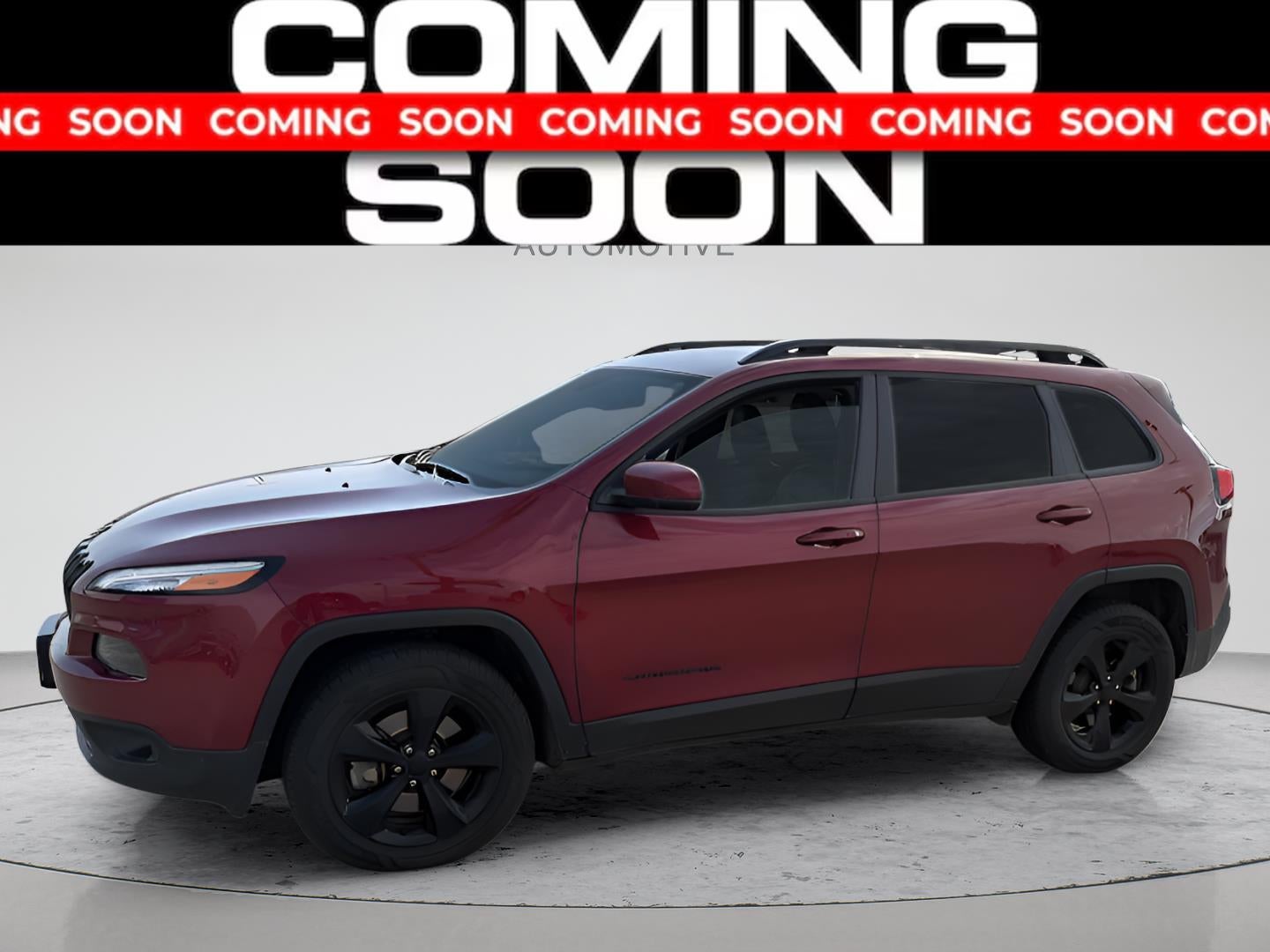 2016 Jeep Cherokee High Altitude in Red — front three-quarter view