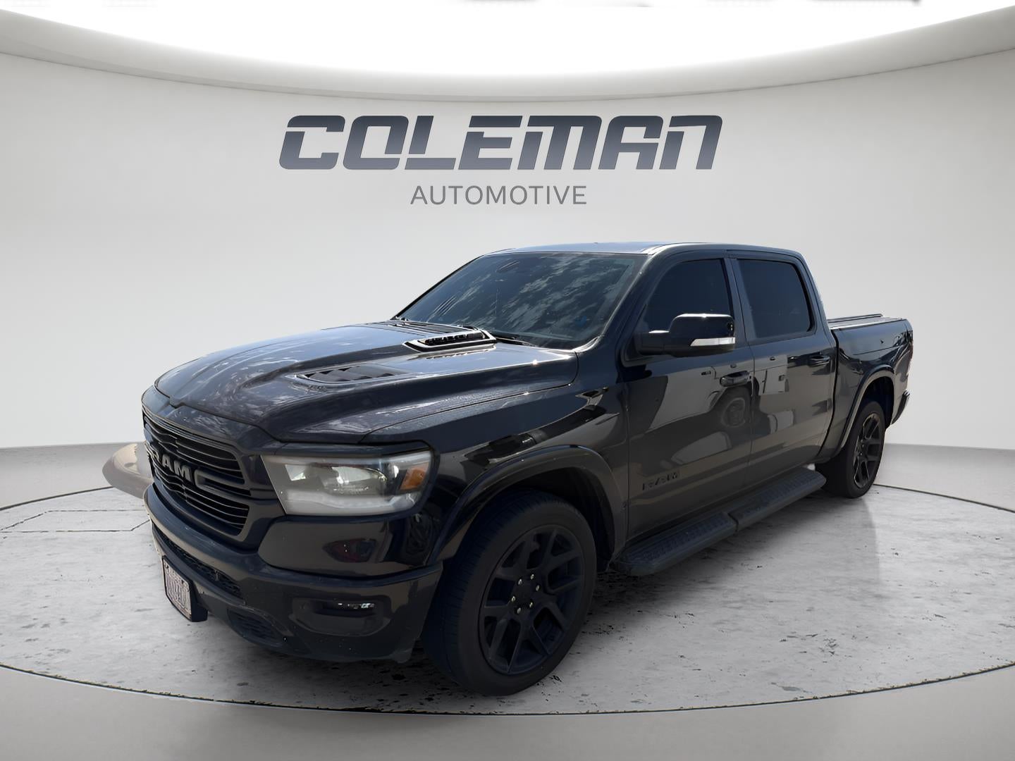2022 RAM 1500 Laramie in Black — front three-quarter view