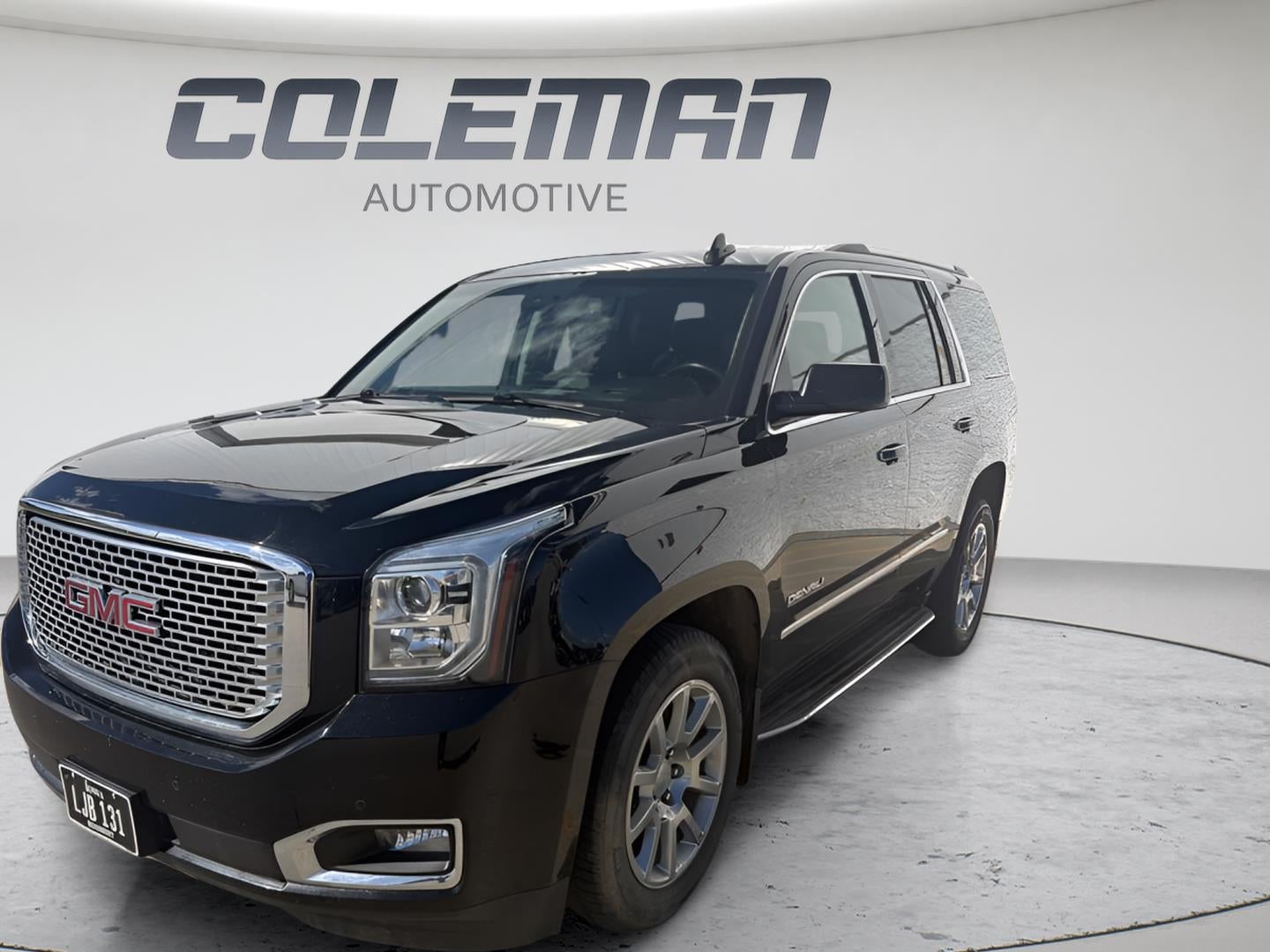 2016 GMC Yukon Denali in Onyx Black — front three-quarter view