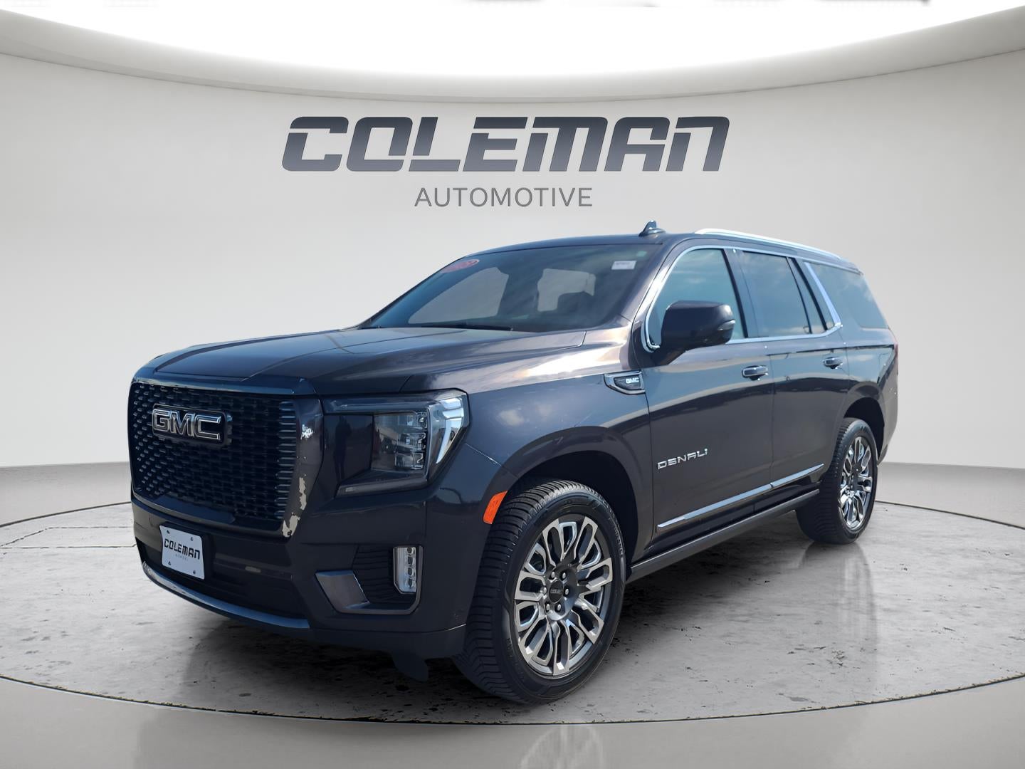 2023 GMC Yukon Denali Ultimate in Titanium Rush Metallic — front three-quarter view