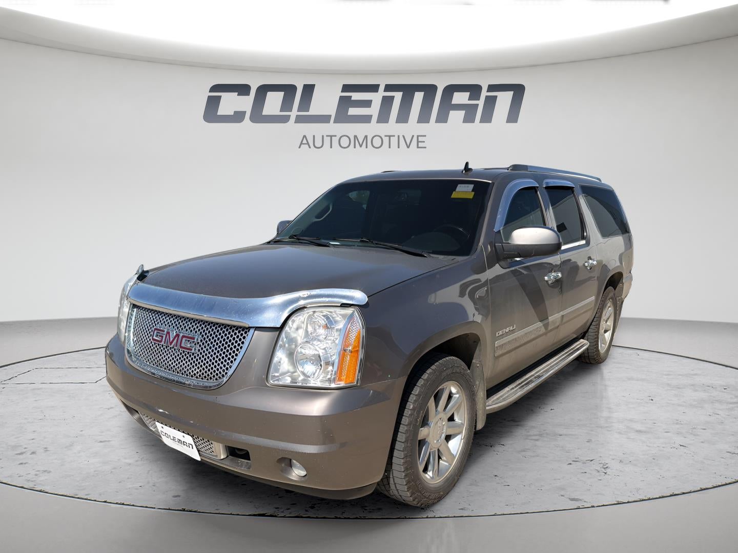 2011 GMC Yukon XL Denali in Mocha Steel Metallic — front three-quarter view