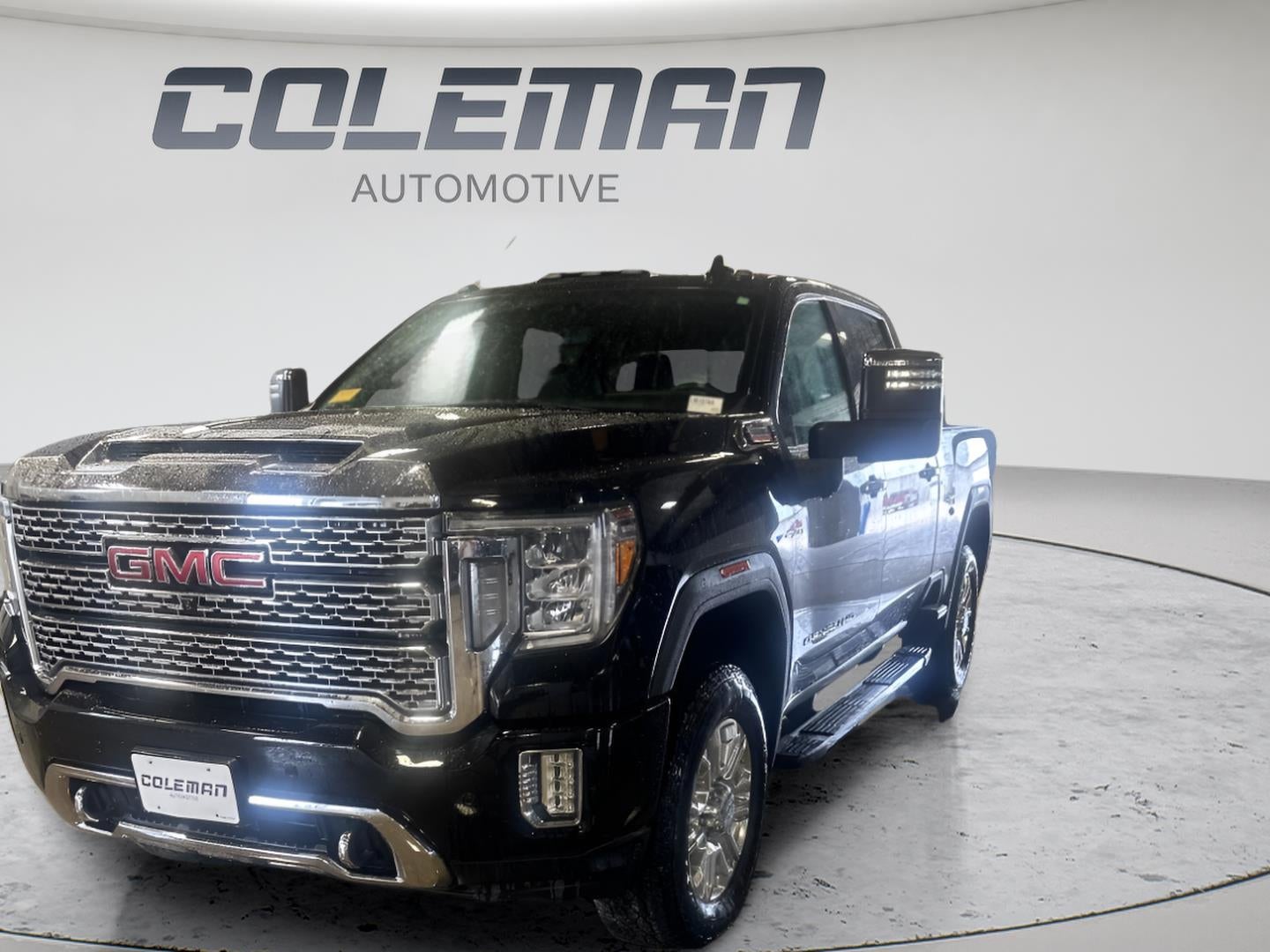 2020 GMC Sierra 2500 HD Denali in Onyx Black — front three-quarter view