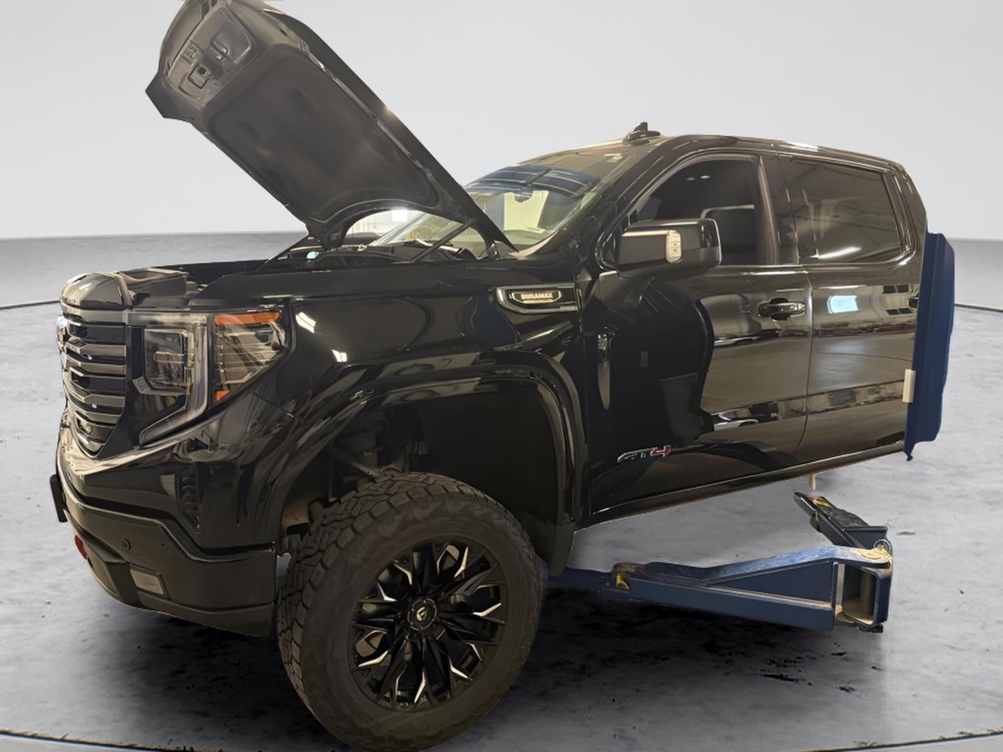 2025 GMC Sierra 1500 AT4 in Onyx Black — front three-quarter view